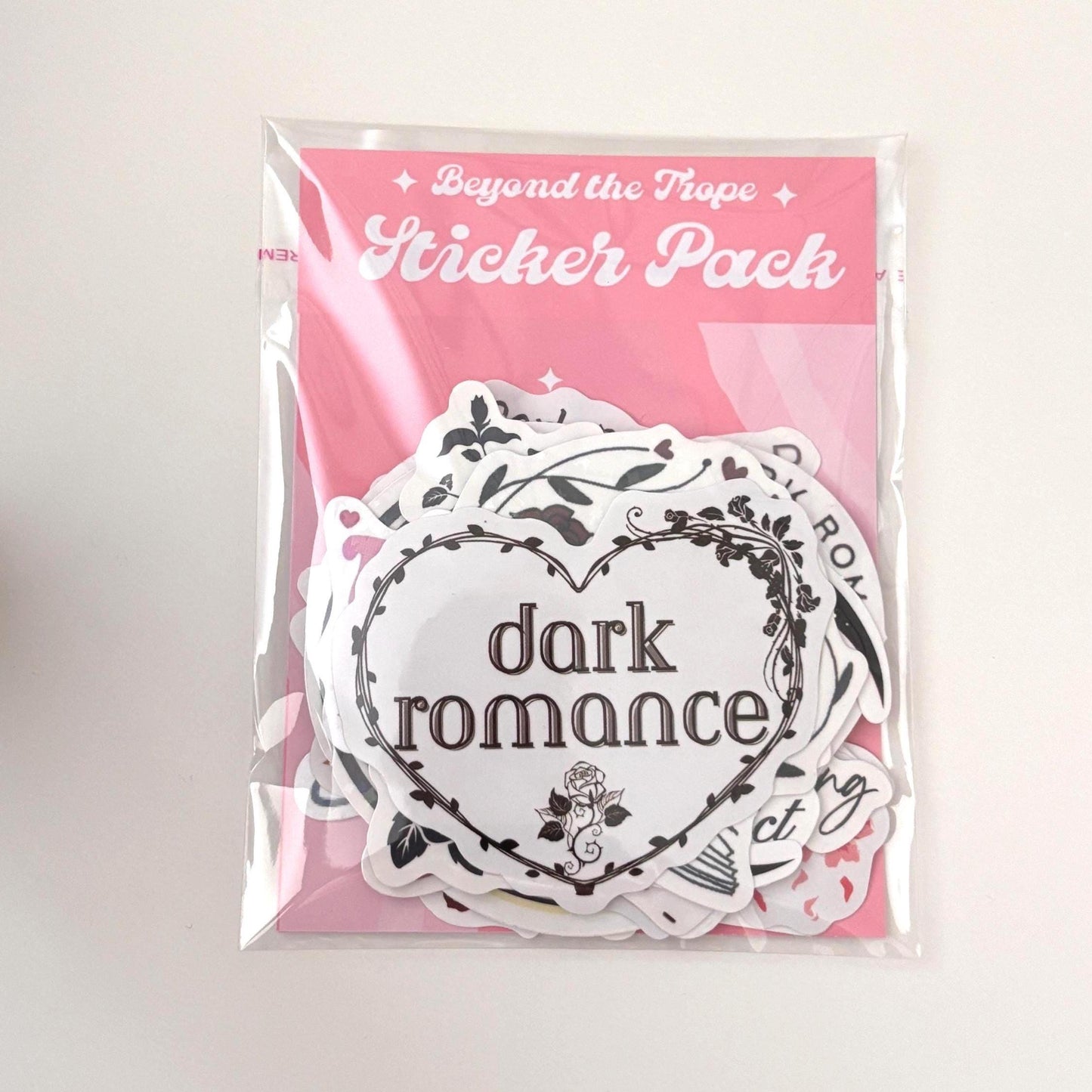 Bookish vinyl sticker pack includes 10–50 waterproof and holographic book stickers designed for Kindles, laptops, and water bottles. These reading-themed decals are perfect for journaling or gifting. Includes vinyl stickers, bookish stickers store, book sticker sheet, Kindle paperwhite, laptop decal, waterproof stickers, book club stickers, and booktok stickers. Dark romance lover. Romantasy books lover.