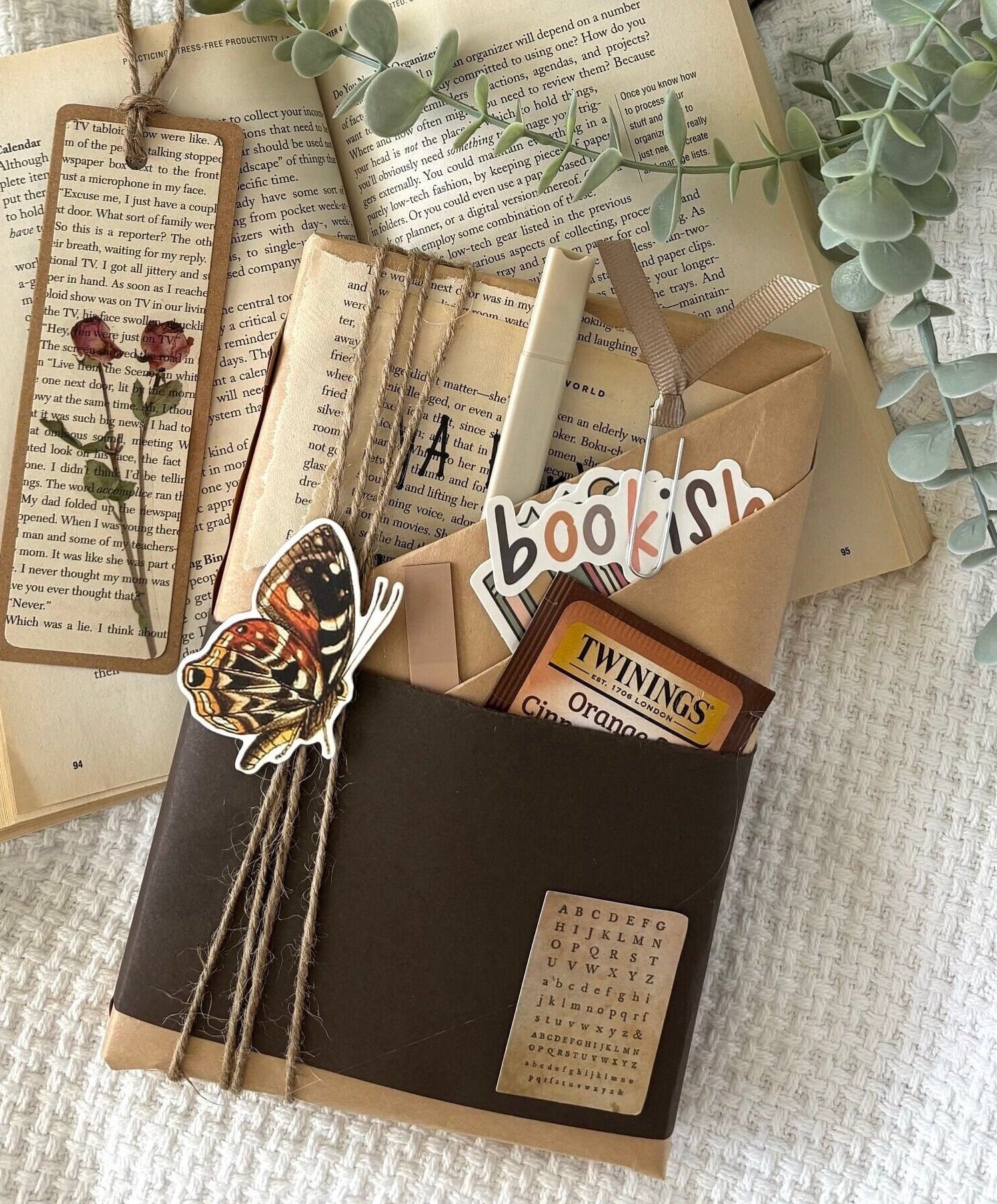 Blind date with book featuring a mystery book wrapped in kraft paper, perfect as a book gift or reading gift for book lovers and romantasy fans. Includes optional book accessories like a reading log and smut stickers. A great bookstagram worthy treat yourself moment or book club surprise. Ideal for booktok fans, dark romance lovers, or anyone seeking a book-only version of a mystery box gift, smut box, or book lover gift box with vintage vibes and cozy charm.