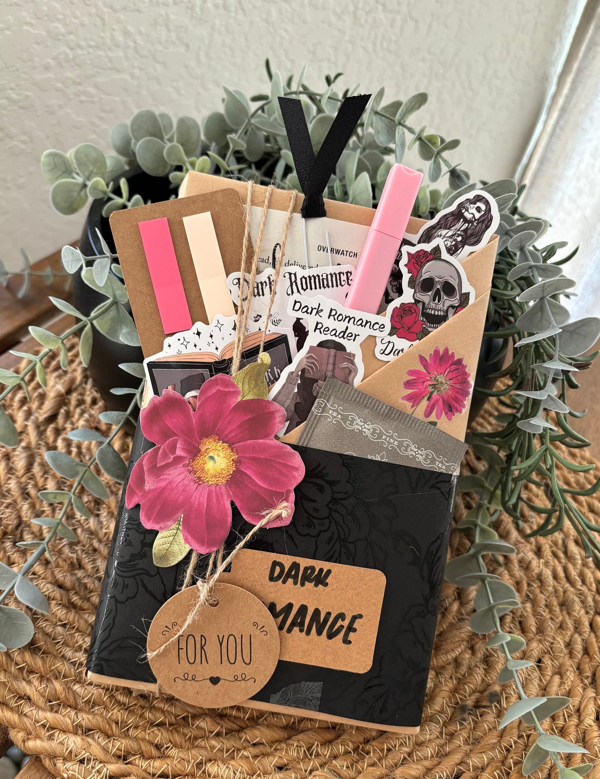 This dark romance book gift is part of a blind book dates collection made for spice-loving bookworms. Includes a blind book, reading log, smut stickers, tea, and annotation tools inside a surprise box. Whether for yourself or a loved one, this custom book box is perfect for romantasy merch fans or mystery box vintage lovers. Makes a great gift for book lover friends or readers in the mood for a spicy, cozy, hygge gift box treat.