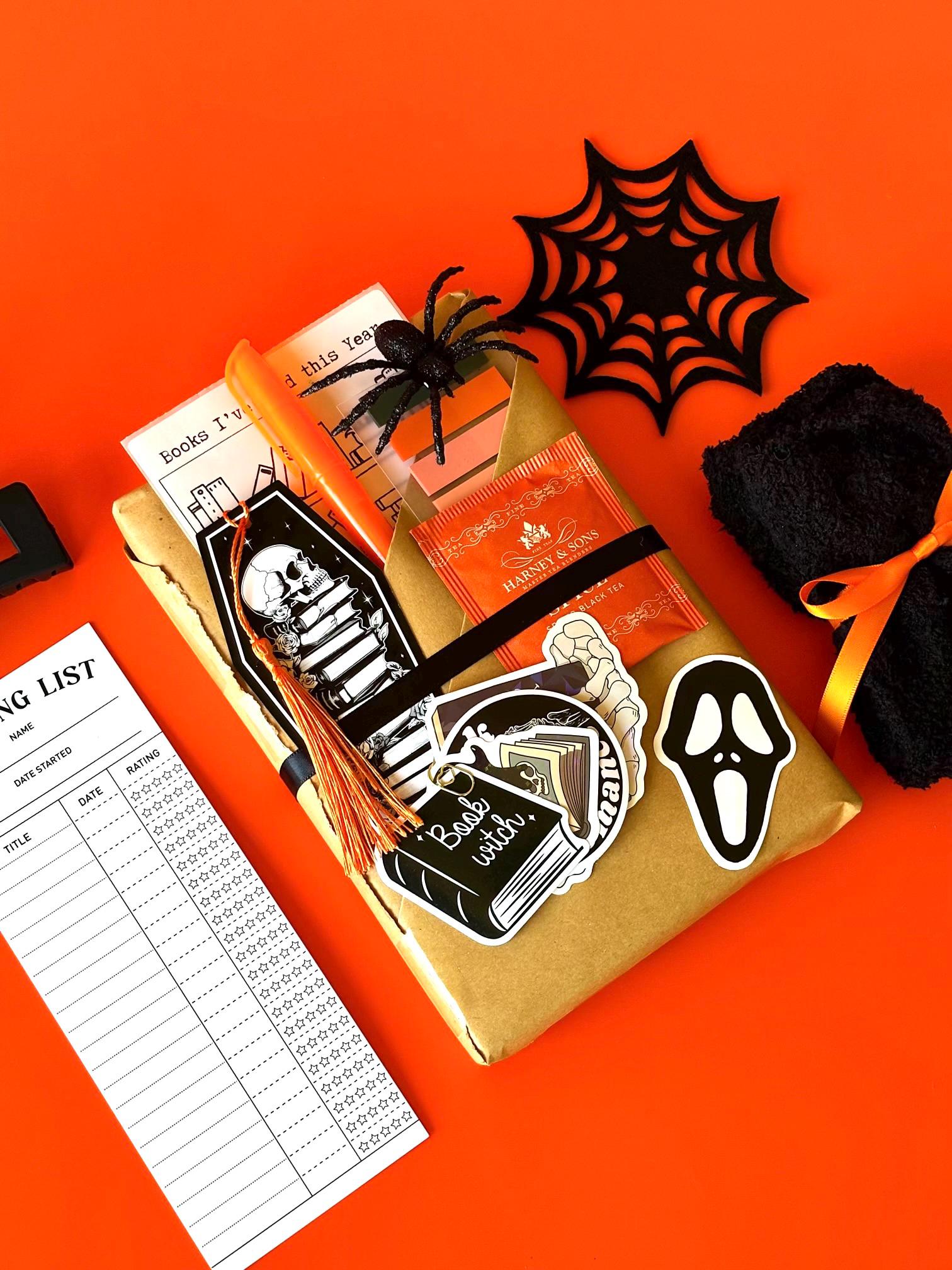 Unwrap a dark romance mystery box filled with surprises. This Blind Date with a Book box features a carefully selected book wrapped in beautiful packaging, accompanied by book accessories like a reading log, bookish stickers, and a book tracker. The perfect gift box for readers who enjoy romantic fantasy, mystery, and dark romance books. Ideal for book lovers and those who appreciate a spooky mystery box experience. book lover gift box romantasy mystery box gift