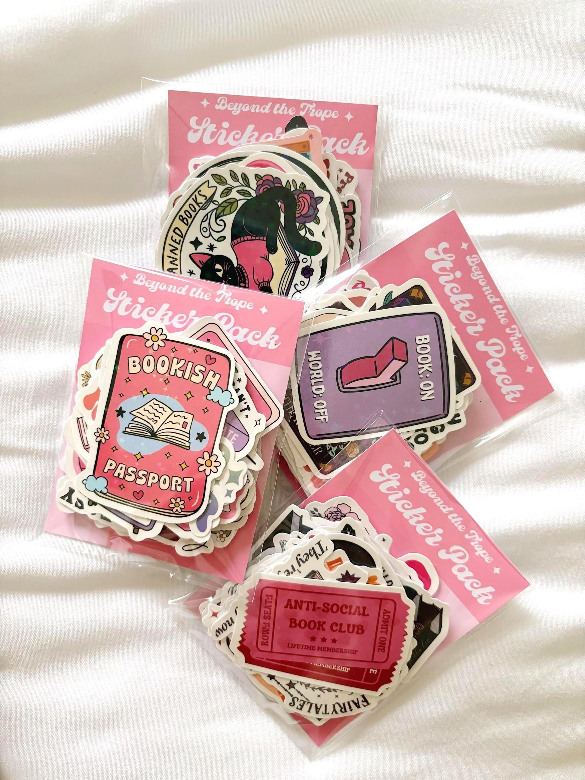 Bulk bookish sticker pack includes 10–50 waterproof vinyl and holographic decals for readers. Great for Kindle paperwhite, Kindle colorsoft, or laptop decals. Ideal for book journaling or cozy booktok gifts. Includes vinyl stickers, book sticker sheet, bookish stickers store, waterproof stickers, booktok stickers, laptop decal, and mystery pack.